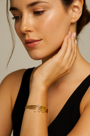 Gold Wave Elegance Bracelet with Sparkling Stones – Designer Artificial Jewelry for Women