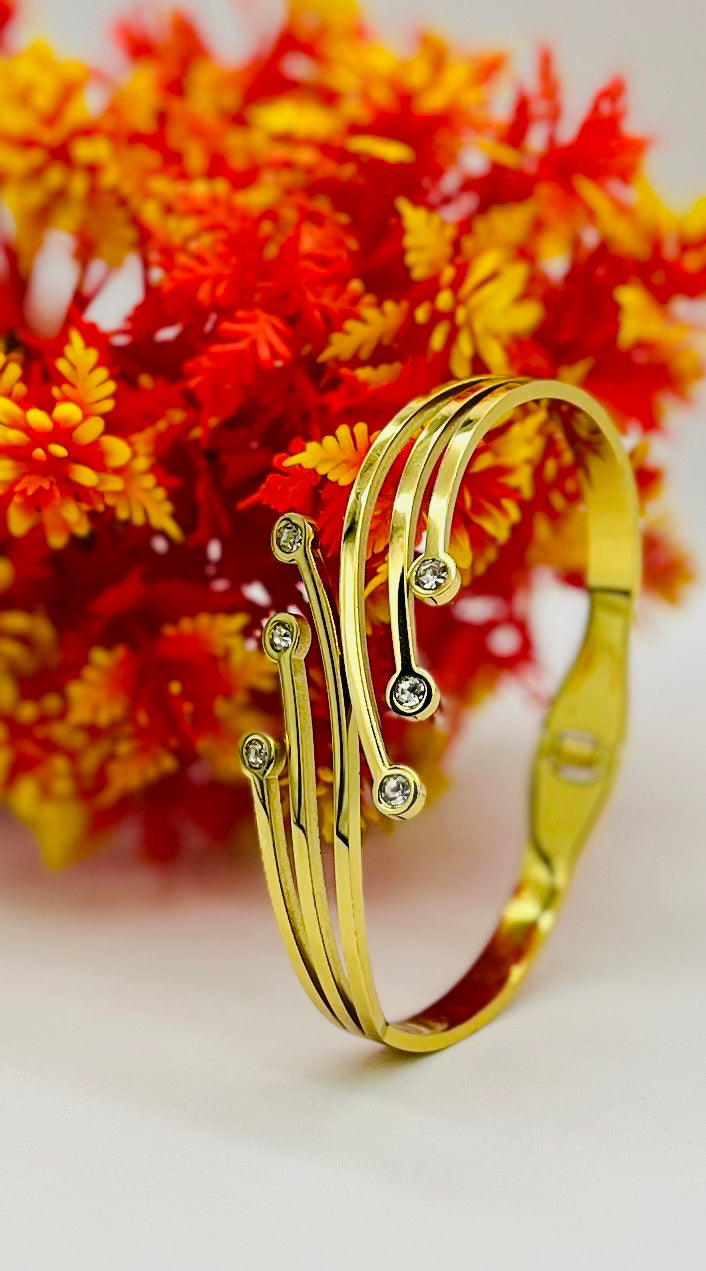 Gold Wave Elegance Bracelet with Sparkling Stones – Designer Artificial Jewelry for Women