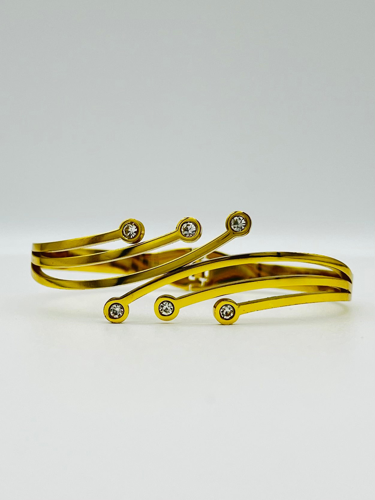 Gold Wave Elegance Bracelet with Sparkling Stones – Designer Artificial Jewelry for Women